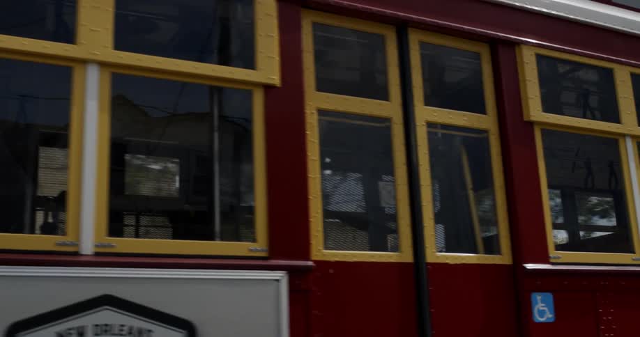 A trolley driving down the street