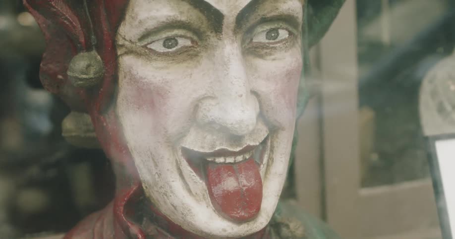A painting of a person sticking out their tongue