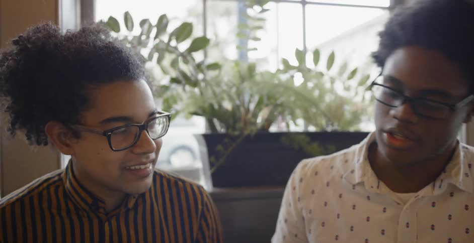 Two people sitting and talking together