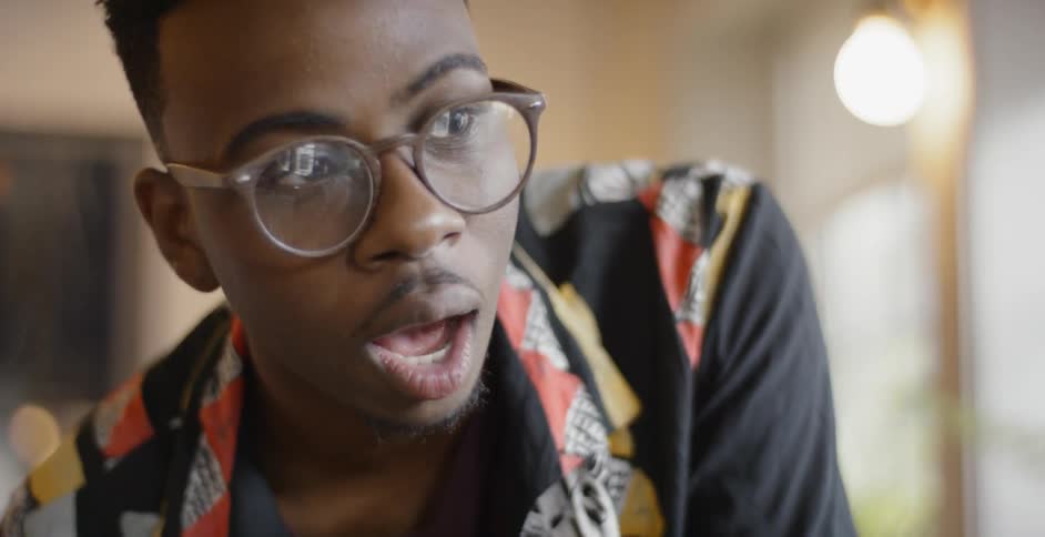 Young man wearing glasses is talking