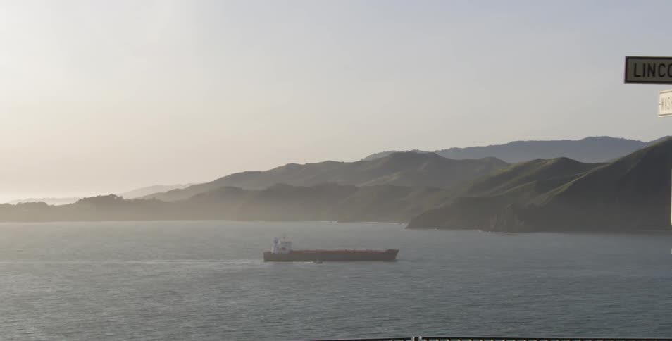 A barge on the water near mountains