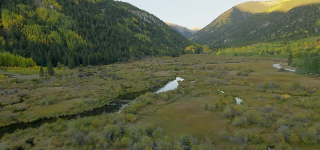 Waterways pass through in valley between mountains