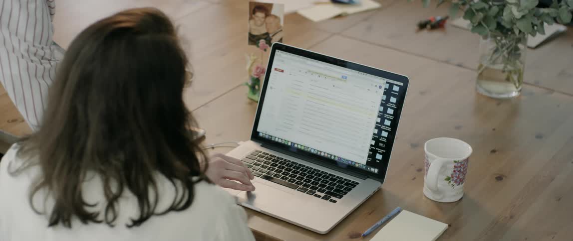 Two women working on a laptop