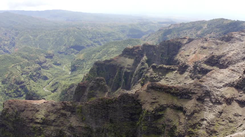 A huge mountain range unfold into a large valley