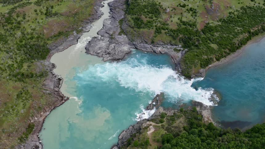 A river slows down a waterfall onto a lower plateau