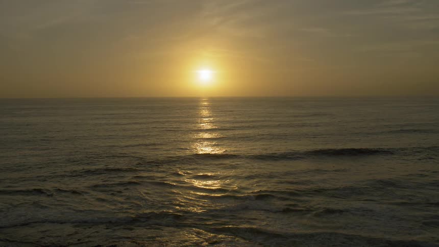 Ocean with waves at sunset