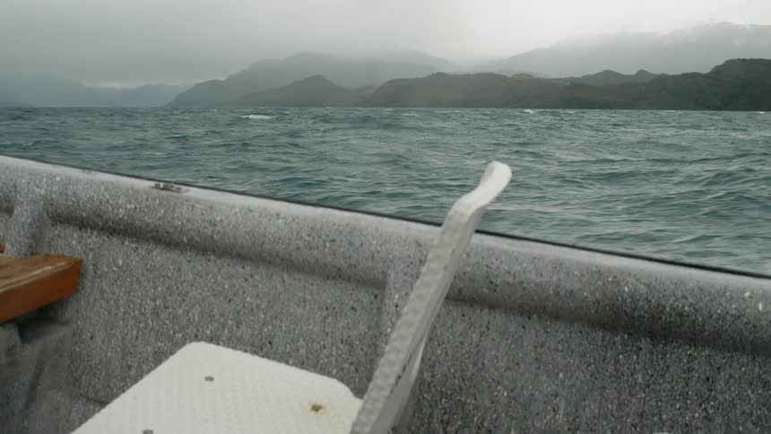 A boat sailing across the sea