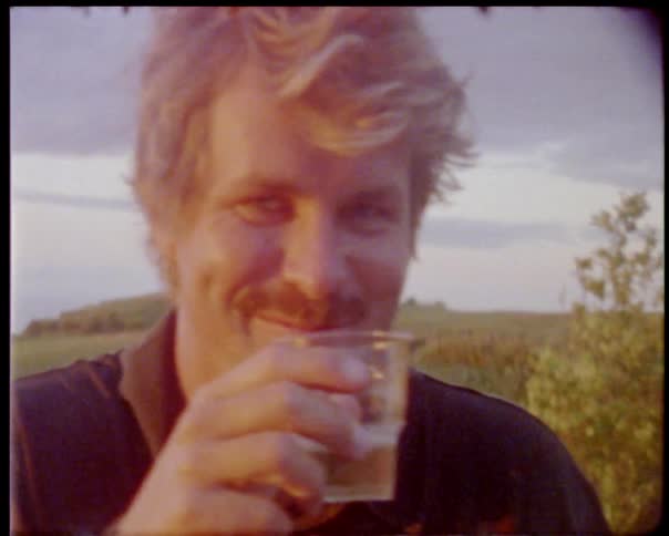 A man drinking a shot