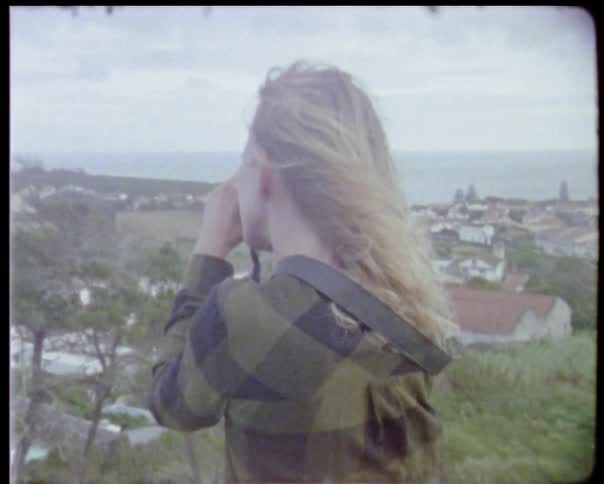 A woman takes pictures of the view