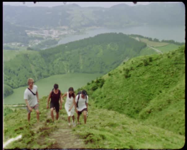 A group of people are walking outdoors