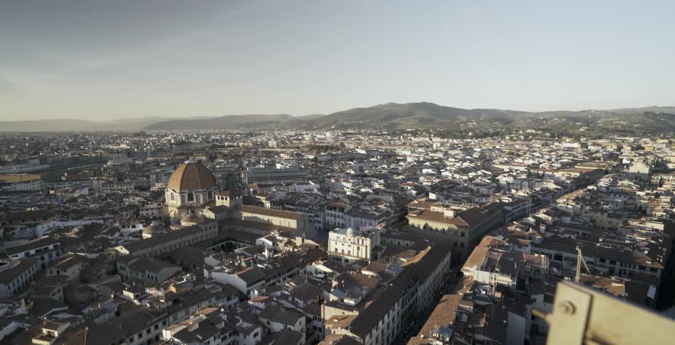A domed building sits above a city skyline