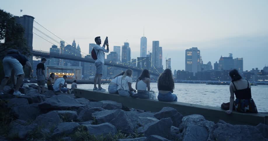 Teens watch sunset in Brooklyn