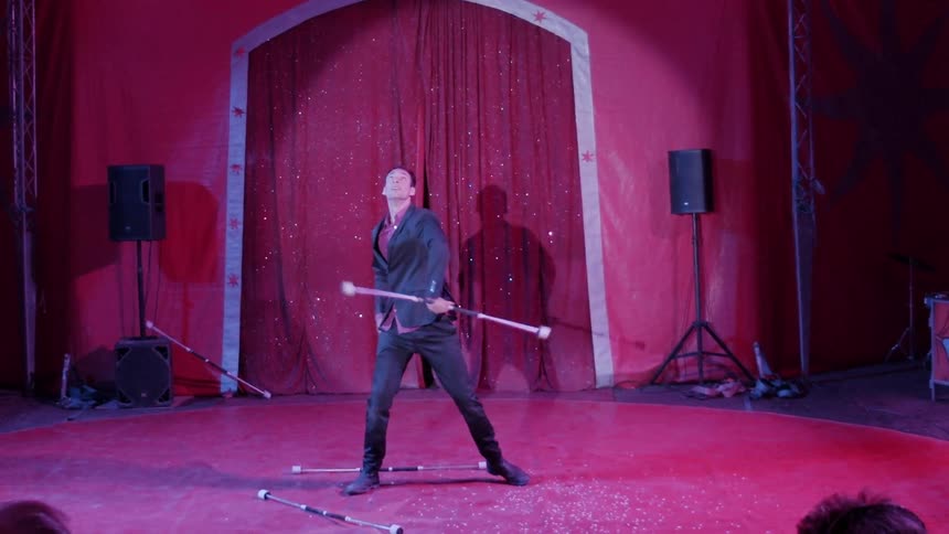 Man twirling batons