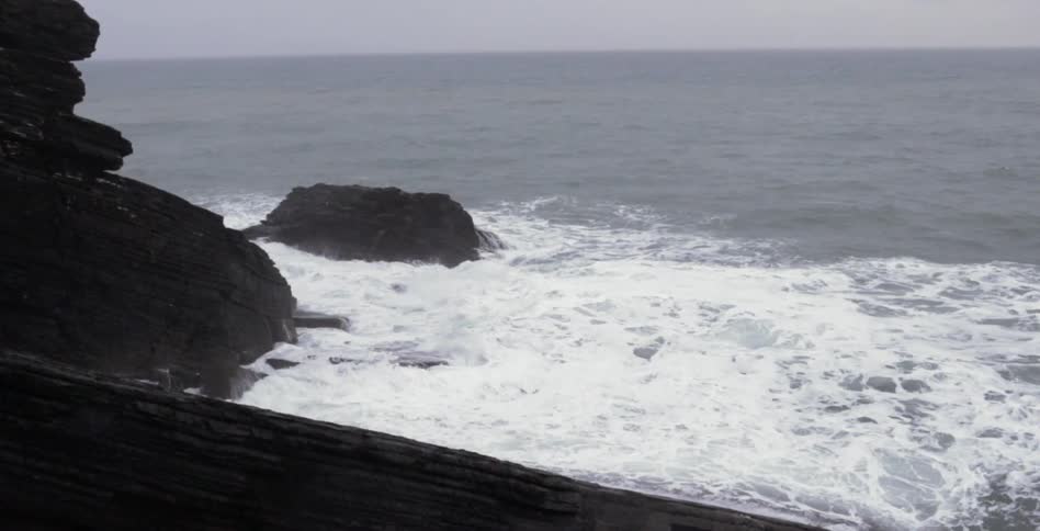 Waves are crashing on the shore