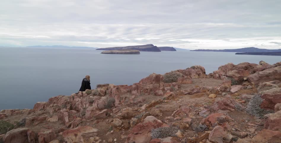 A woman walking along the cliffs