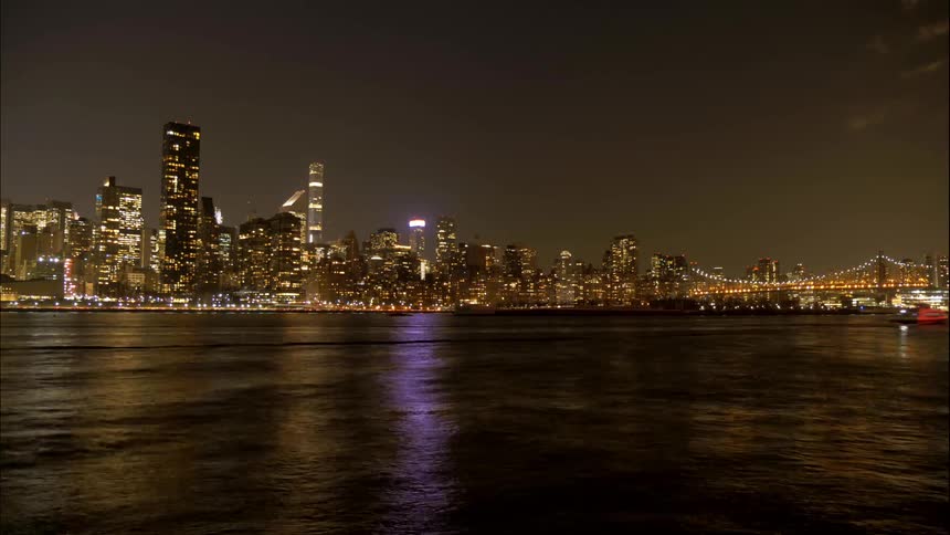 Timelapse of city skyline near water