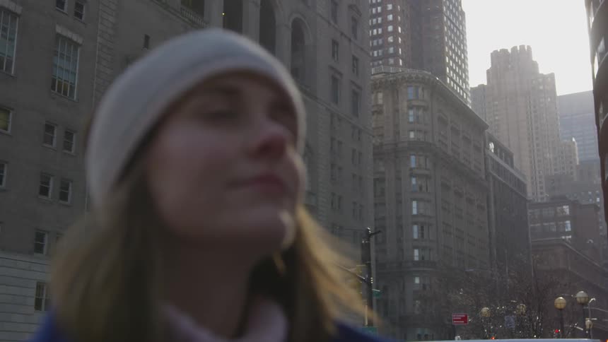 Woman with beanie in city