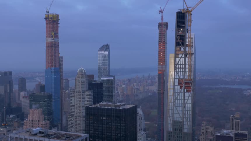 Smoke exits from roof of tall building in city