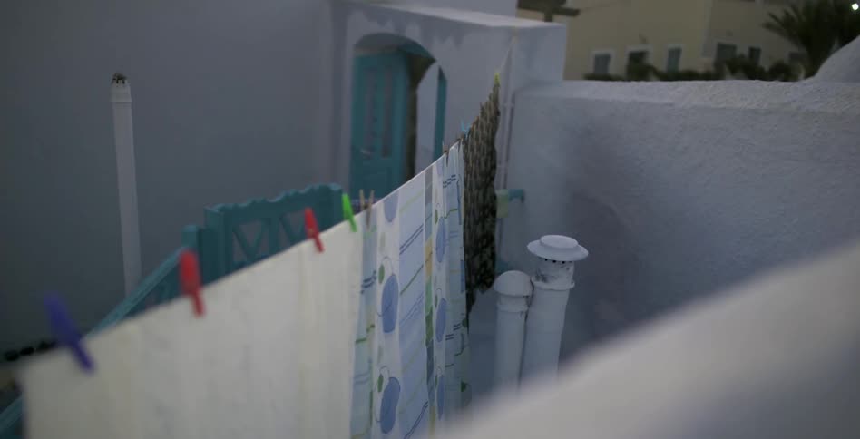 Clothes hang on lines in a yard