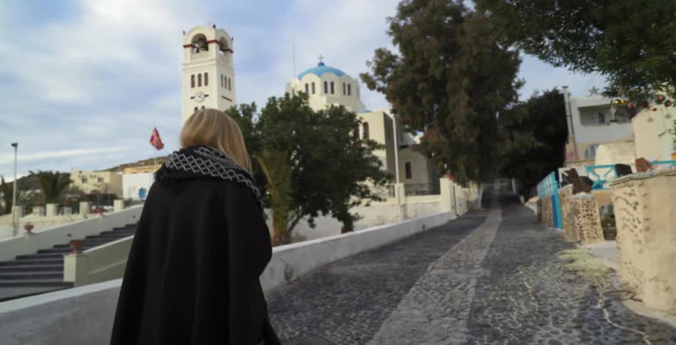 A woman walking up a path