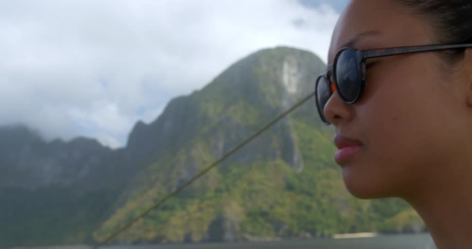 A woman is looking out over a mountain