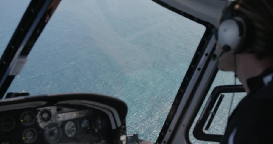A person flying a helicopter