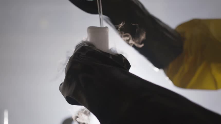 A scientist mixing a potion