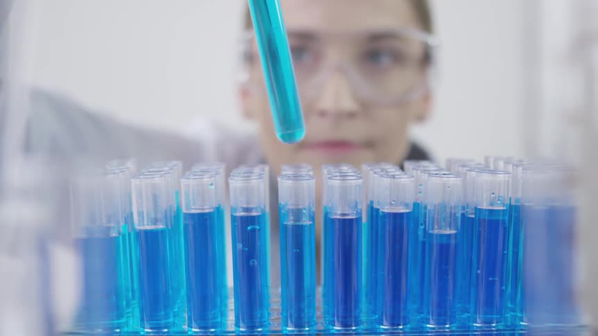Technician picks up test tube