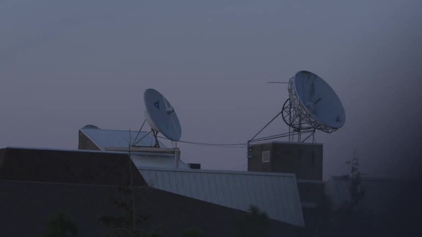 Satellites on top of a building