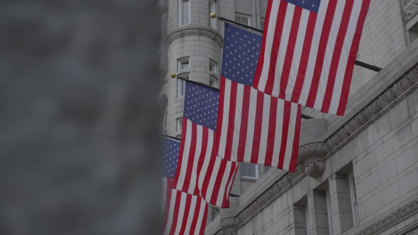 Flags are displayed on a building