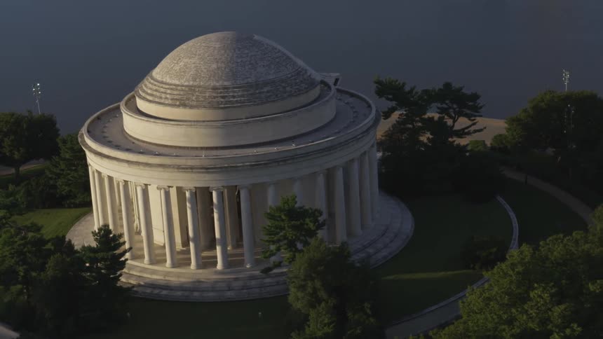 Camera looks down on a large circular building