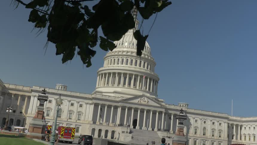 An emergency vehicle is parked in the driveway of the white house
