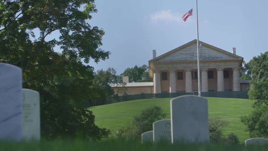 A flag flies over a graveyard