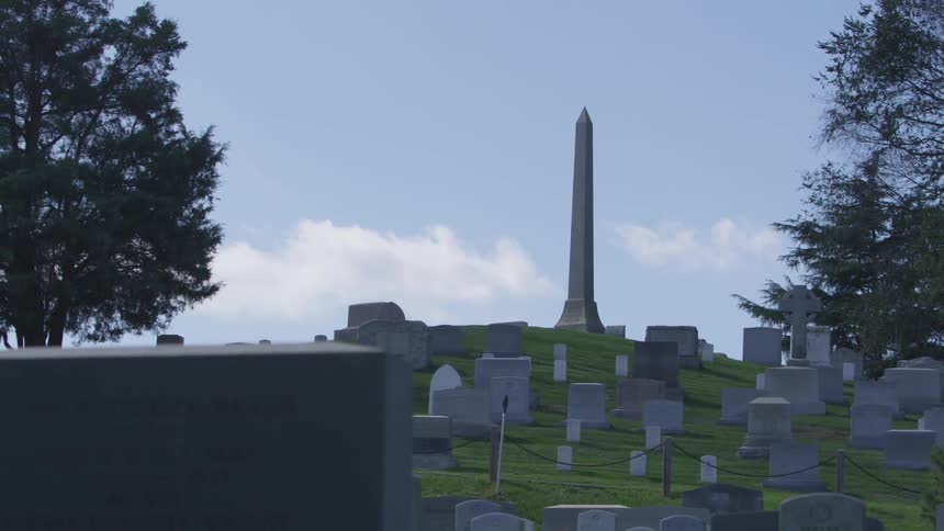 Washington monument over a graveyard