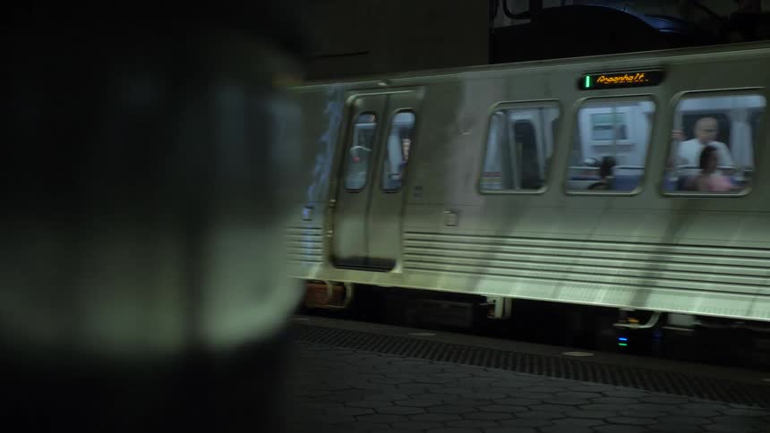 Subway train leaves station underground