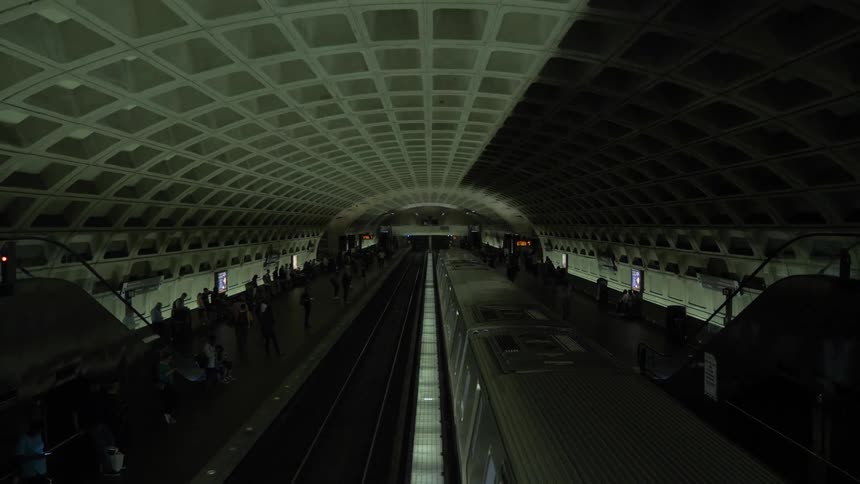 A subway train is arriving at the turmoil