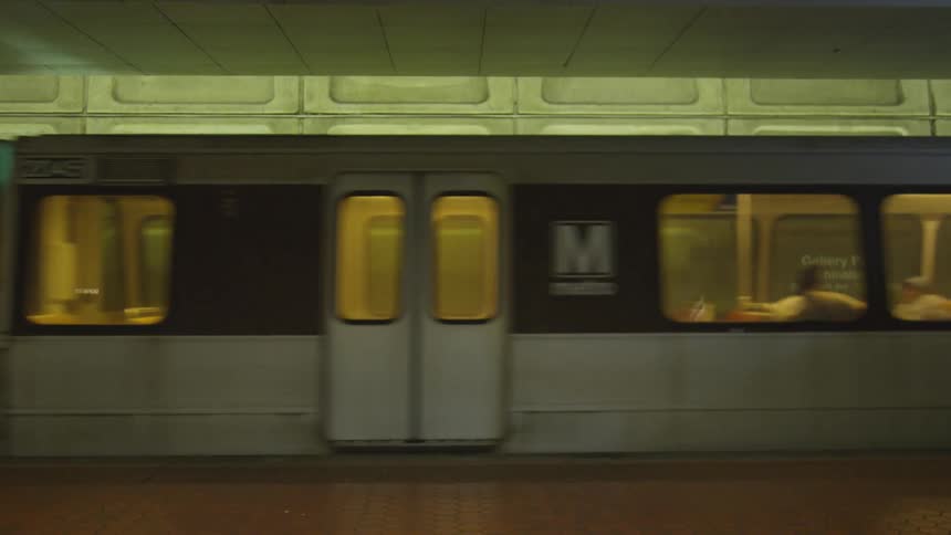 People riding on a subway train