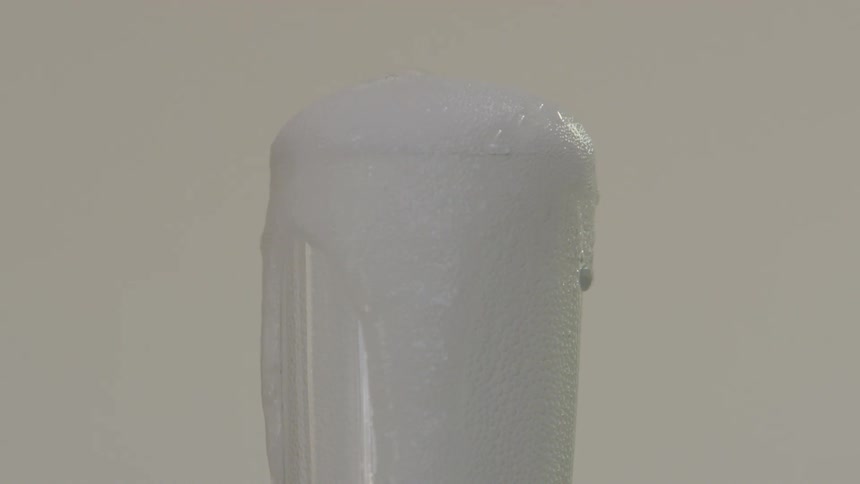 Champagne pours from a bottle into a glass