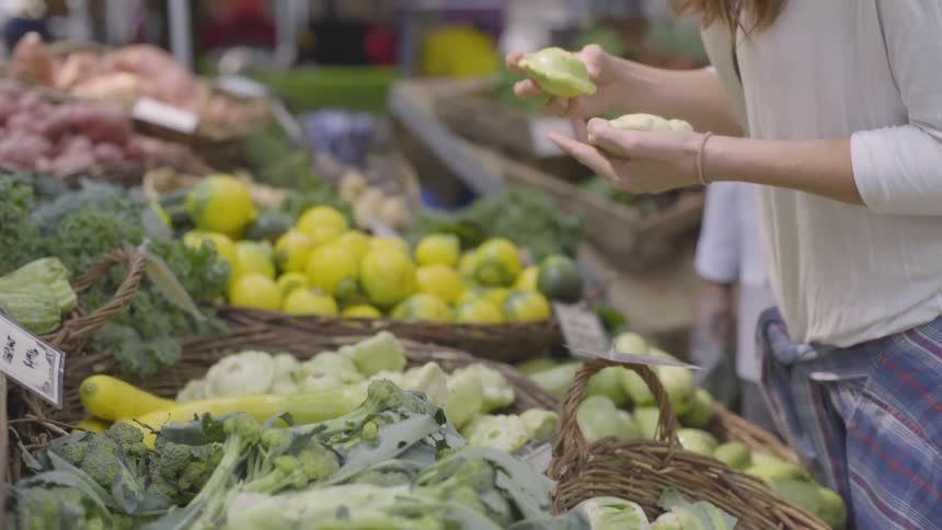 Woman gathers produce at the market
