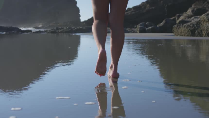 Girl walking on the beach