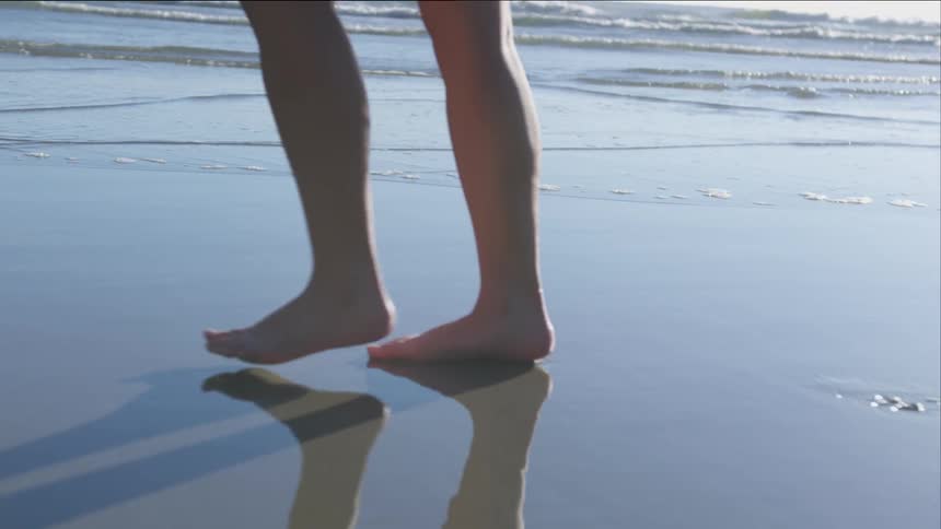 Person walking along a beach
