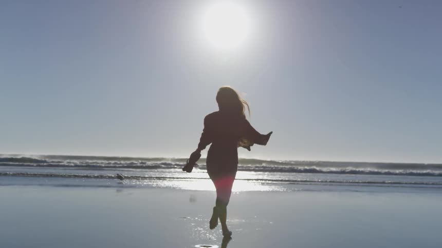 Girl running on a beach