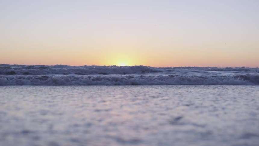 Ocean waves at sunset