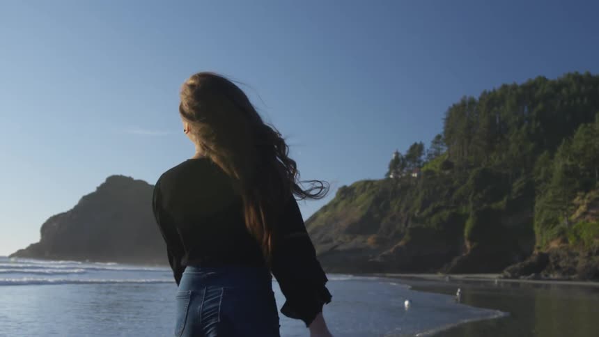 A woman playing on a beach