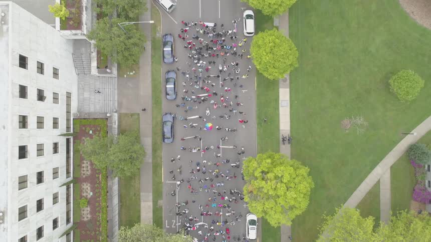 People marching down the street in the city