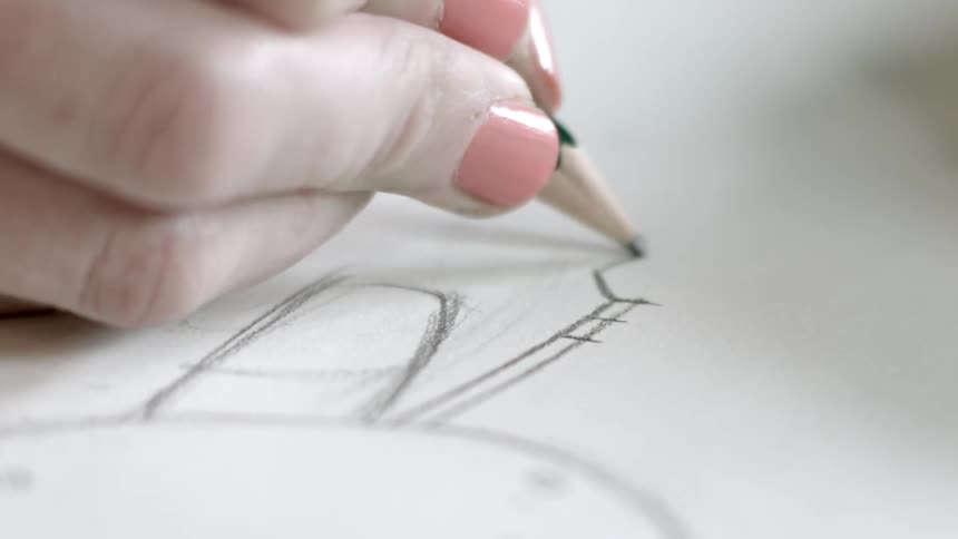 A person drawing with a pencil