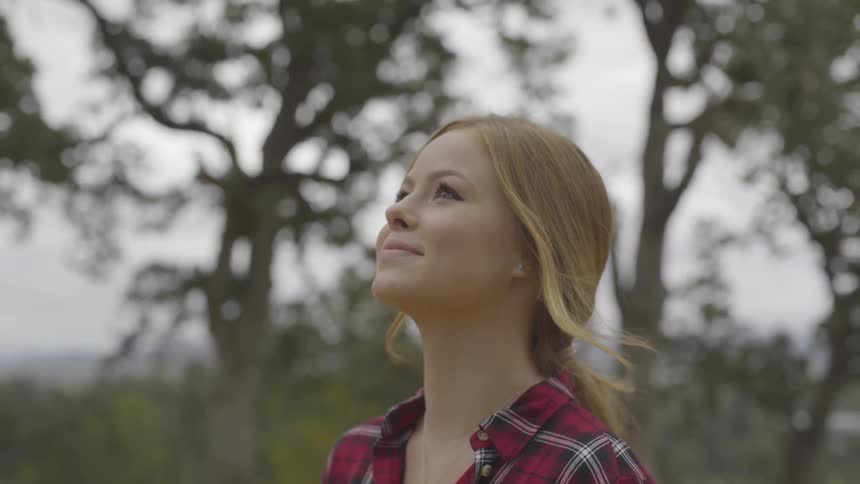 A woman looking up to the sky