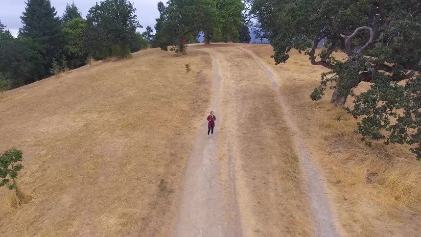 Person walks down a hiking trail