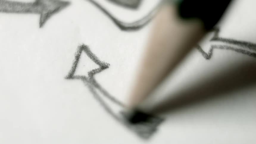 A pencil shades in a drawing of an arrow