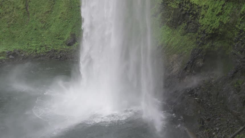 A waterfall crashing down in to the river below